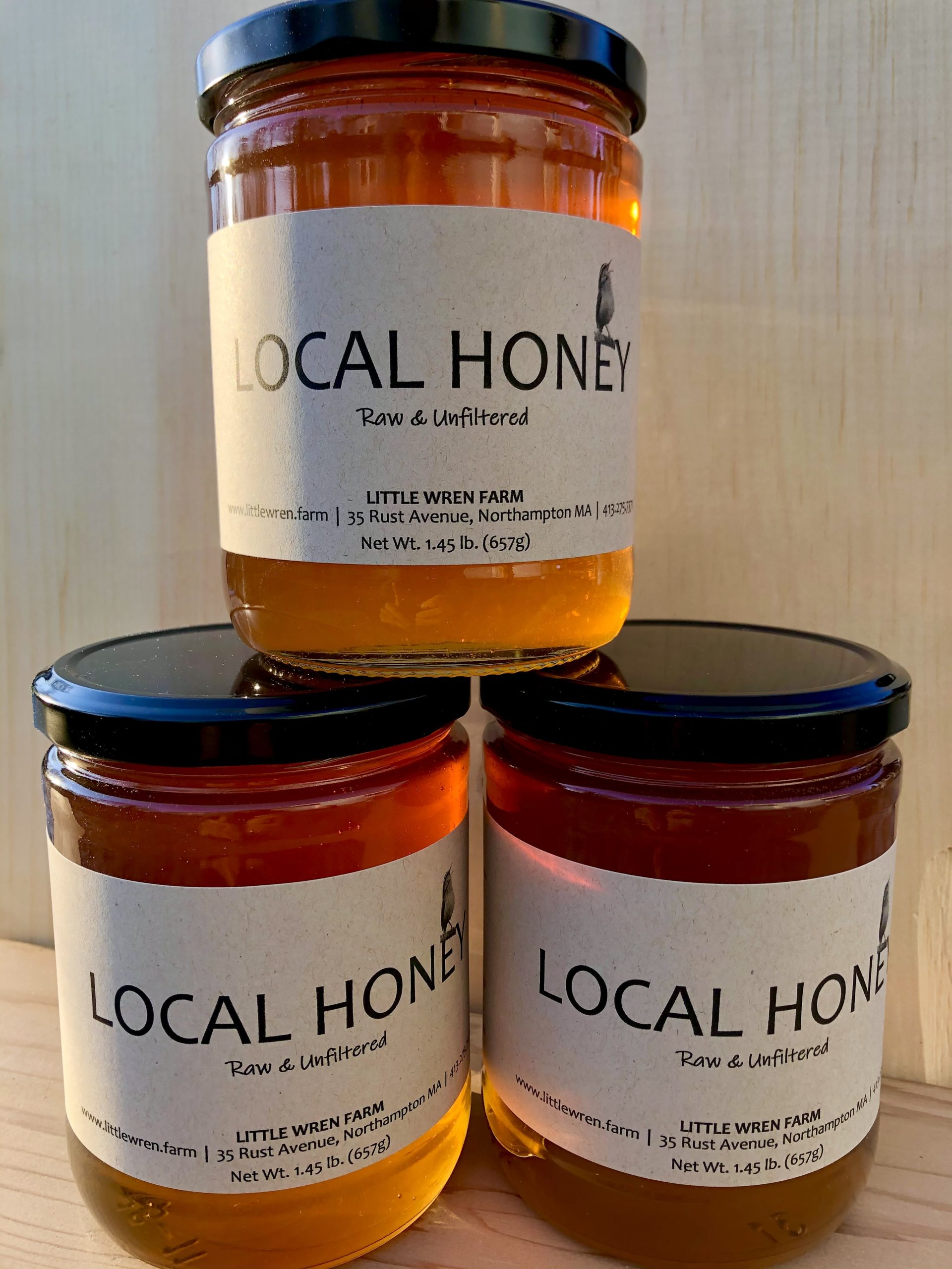 Bottled raw honey at Little Wren Farm apiary