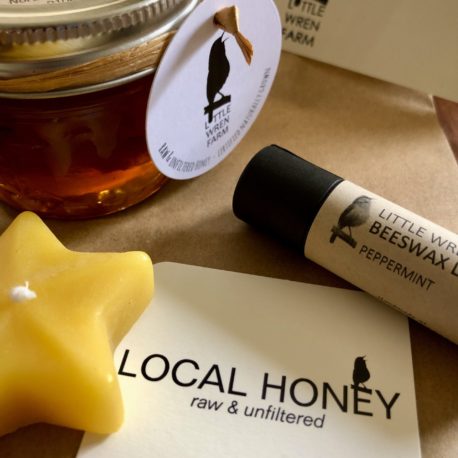 Custom gift bag contents, including comb honey sampler, star candle and lip balm.